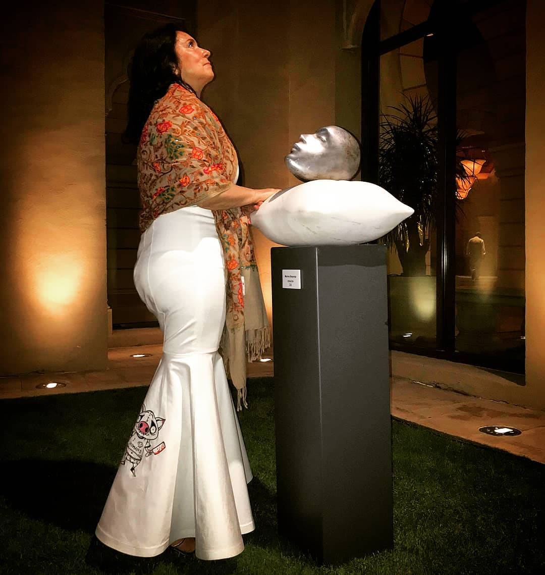 Marina Stoponja beside her sculpture at an exhibition