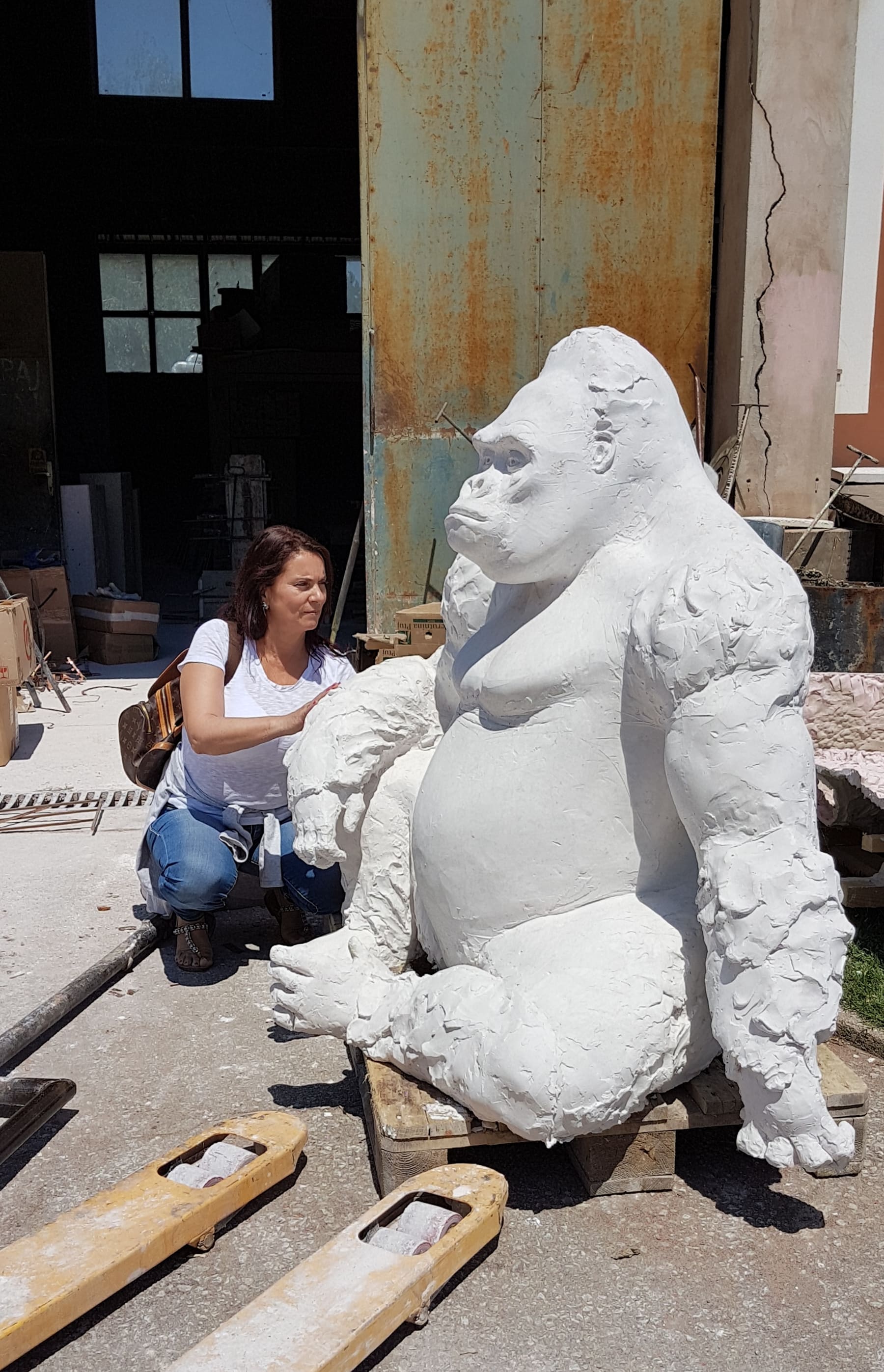 Marina Stoponja working beside a large gorilla sculpture